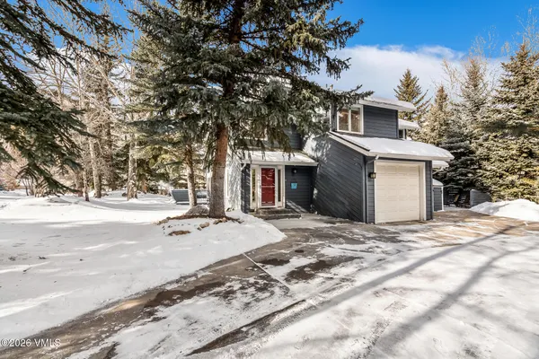 a view of a house with a snow in the yard