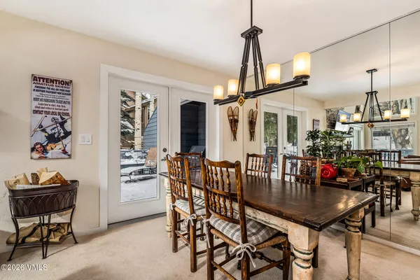 a dining room with furniture and window