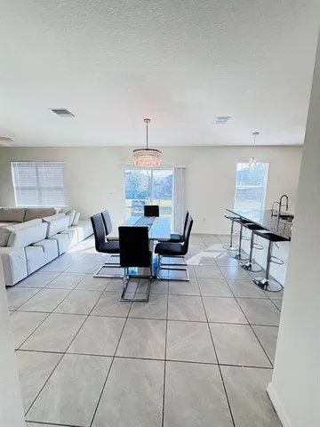 a view of kitchen with furniture and breakfast area