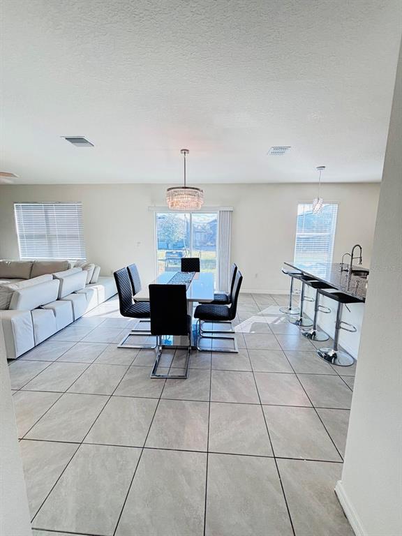 5185 Barombi Bend St. Cloud, FL 34772 - Photo 11 of 47 a view of kitchen with furniture and breakfast area