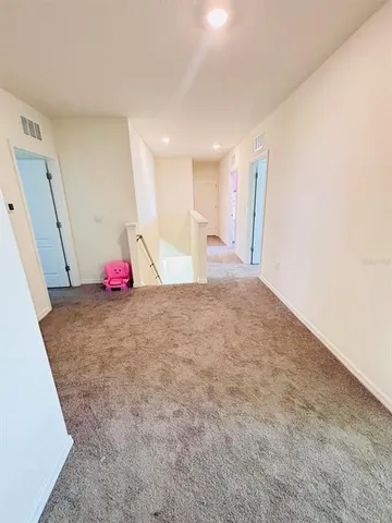 a view of a room with air conditioner duct and window