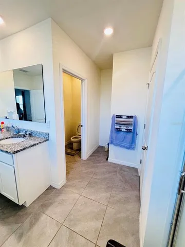 a kitchen with stainless steel appliances a stove and more cabinets