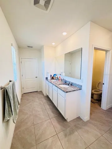 a bathroom with a toilet and a sink