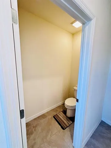 a bed room with a bed and a chandelier