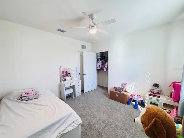 a bedroom with a bed and a fireplace