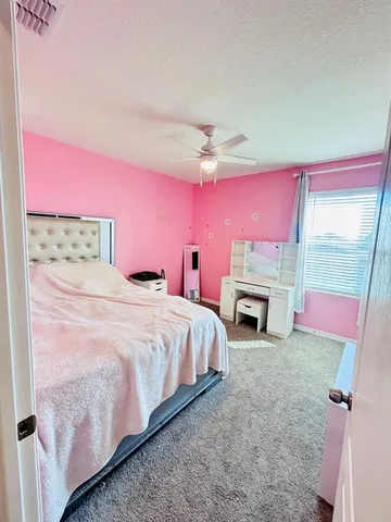 a room with furniture and a flat screen tv