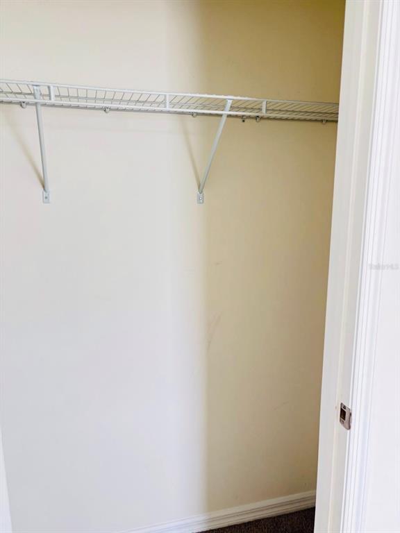 5185 Barombi Bend St. Cloud, FL 34772 - Photo 39 of 47 a view of small space with racks on the wall