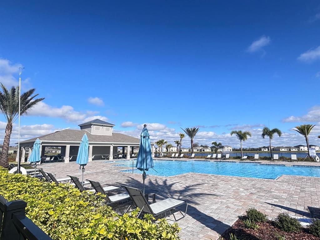 5185 Barombi Bend St. Cloud, FL 34772 - Photo 42 of 47 a front view of a house with garden