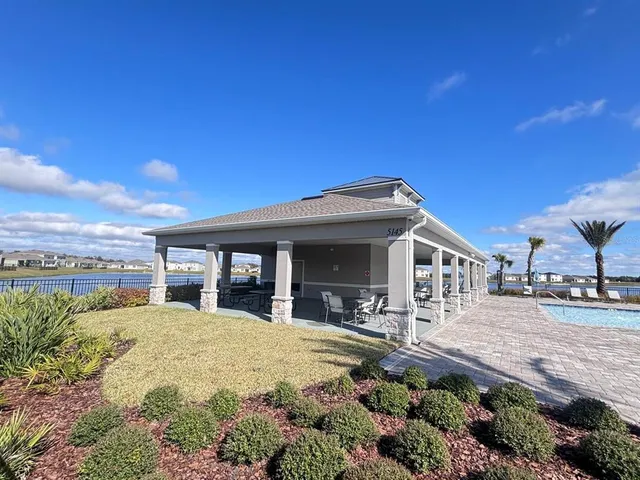 a view of a lake with houses in the back