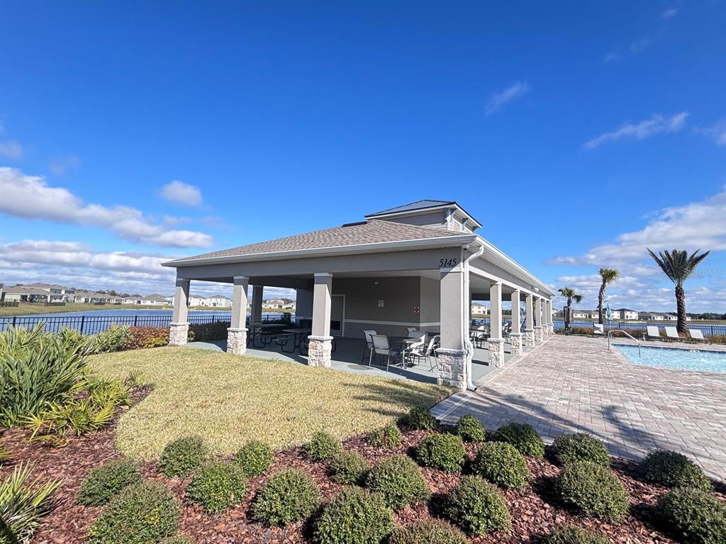 5185 Barombi Bend St. Cloud, FL 34772 - Photo 43 of 47 a view of a house with a patio