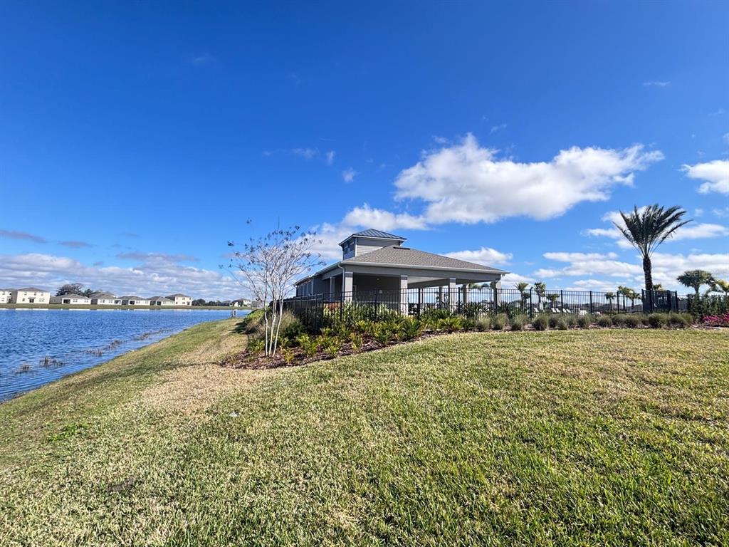 5185 Barombi Bend St. Cloud, FL 34772 - Photo 45 of 47 a view of a house with a yard