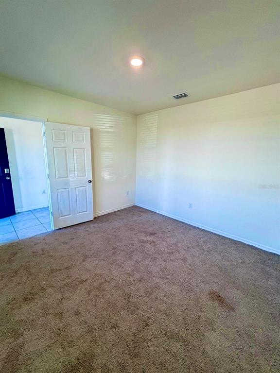 5185 Barombi Bend St. Cloud, FL 34772 - Photo 8 of 47 a view of an empty room