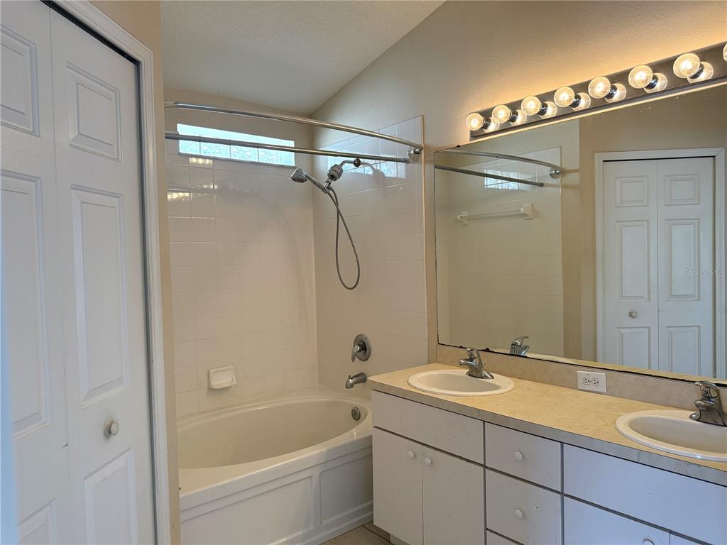 6518 Bridgecrest Drive Lithia, FL 33547 - Photo 12 of 26 a bathroom with a tub sink shower and mirror