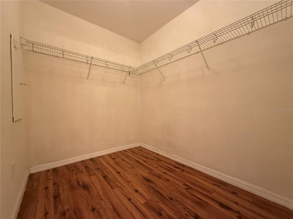 6518 Bridgecrest Drive Lithia, FL 33547 - Photo 13 of 26 a view of a room with wooden floor and fan
