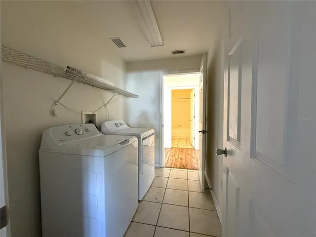 a view of a storage & utility room with a sink