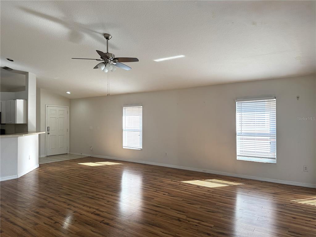 6518 Bridgecrest Drive Lithia, FL 33547 - Photo 3 of 26 an empty room with wooden floor and windows