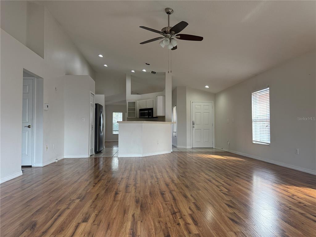 6518 Bridgecrest Drive Lithia, FL 33547 - Photo 4 of 26 a view of empty room with wooden floor and window