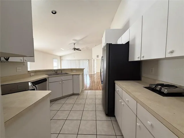 a kitchen with a sink a stove and refrigerator