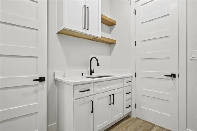 a bathroom with a sink and mirror