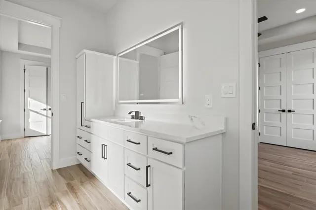 a bathroom with a sink and a mirror