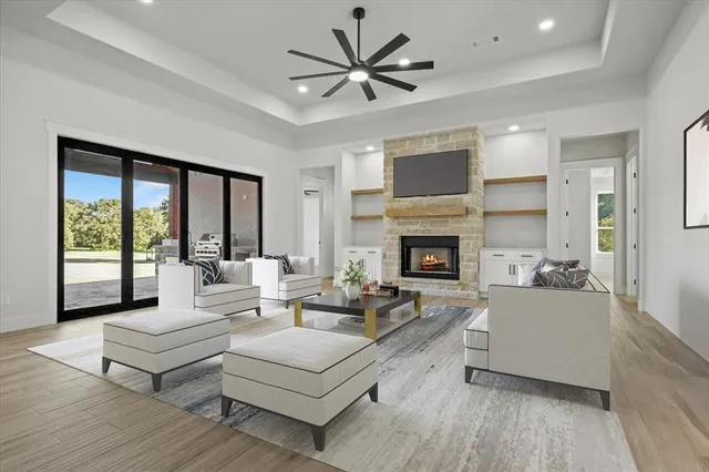 a living room with furniture and a fireplace