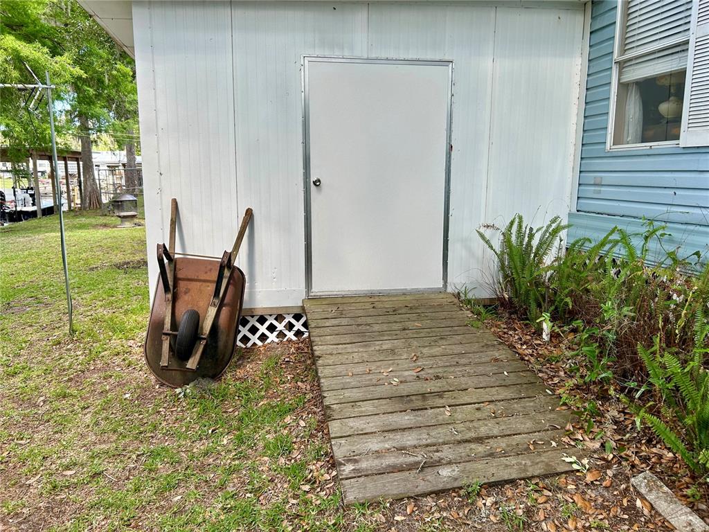 25646 Bass Road Astor, FL 32102 - Photo 44 of 48 a view of outdoor space with a garden