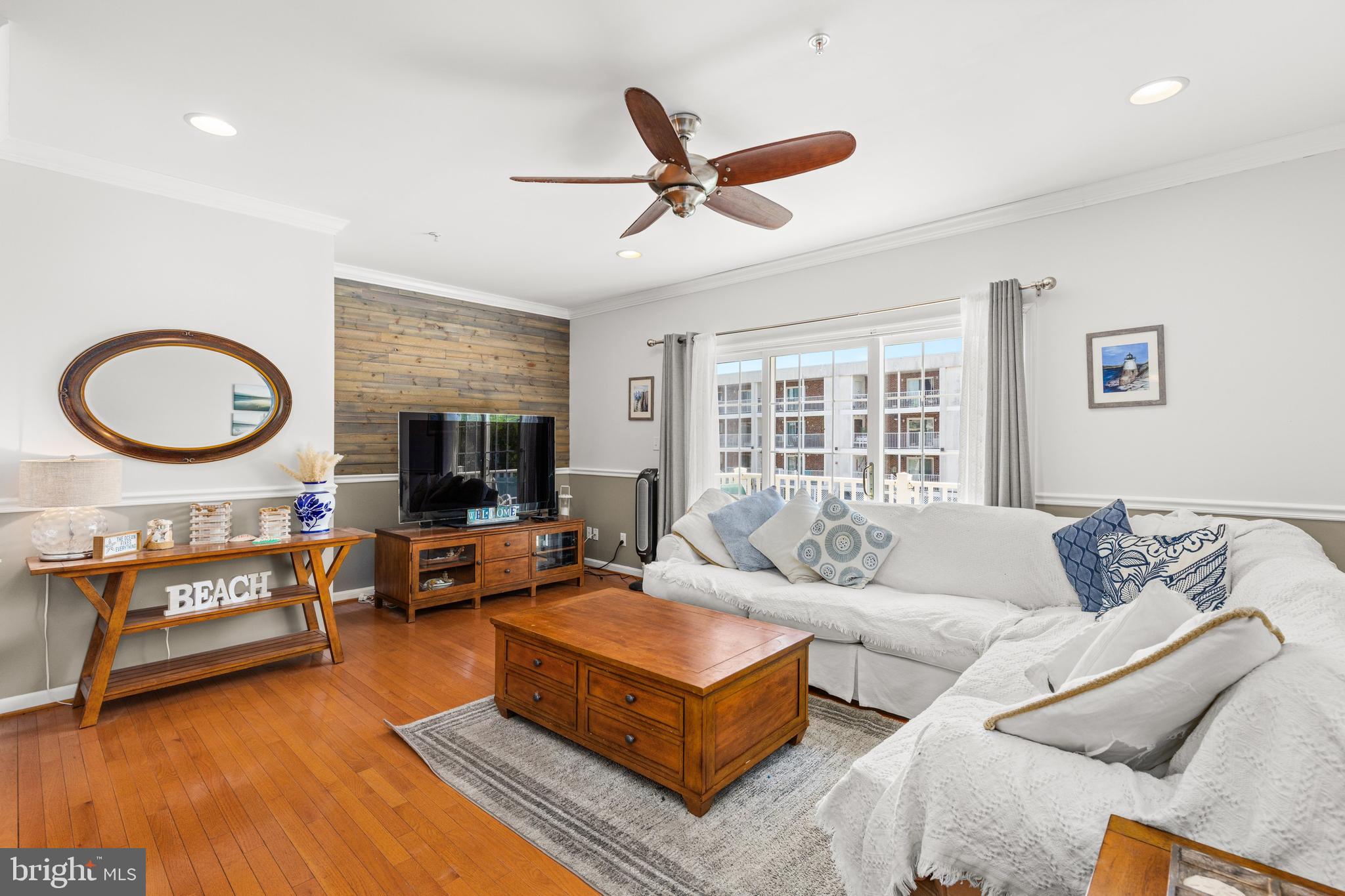 617 Salt Spray Road, Unit B Ocean City, MD 21842 - Photo 42 of 72 a living room with furniture and a flat screen tv