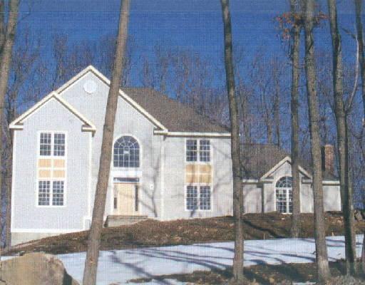 2 Clapboard Ridge Newtown, CT 06482 - Photo 1 of 1 a front view of a house with a yard