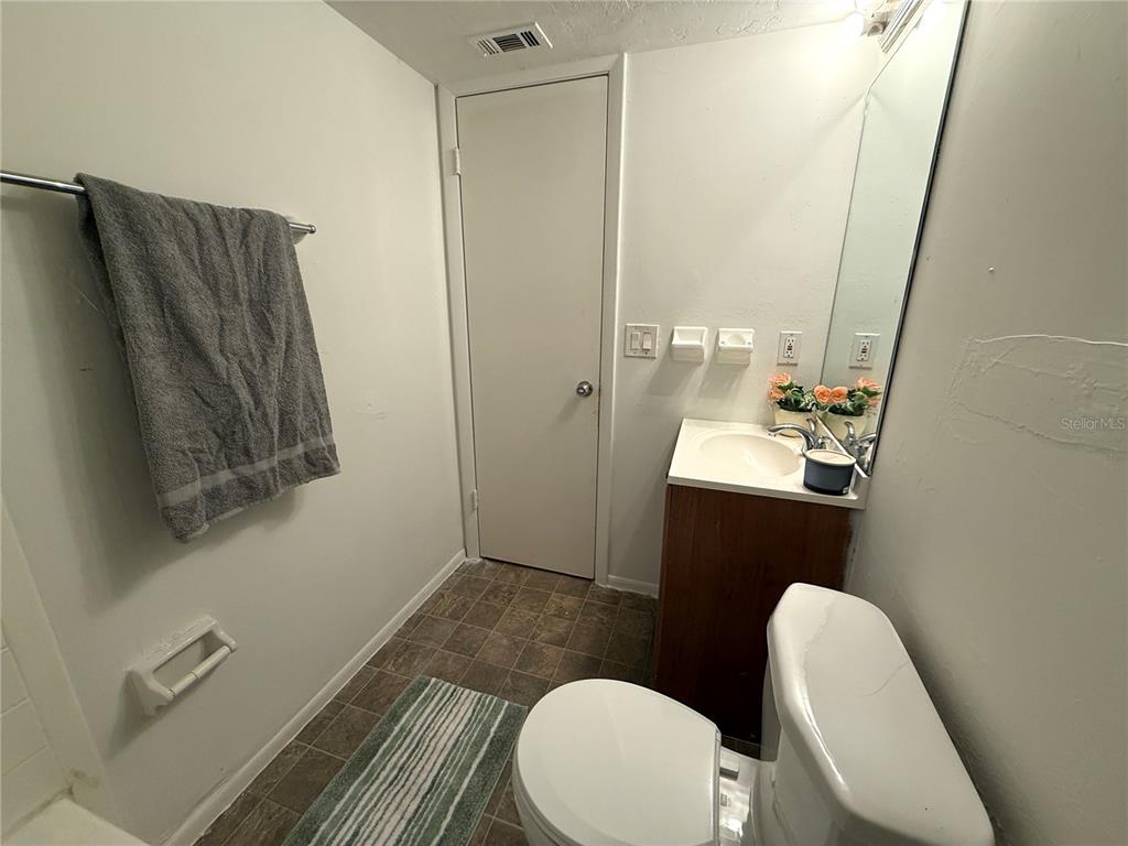 421 Southwest 67th Terrace, Unit A Gainesville, FL 32607 - Photo 8 of 13 a bathroom with a sink and a mirror
