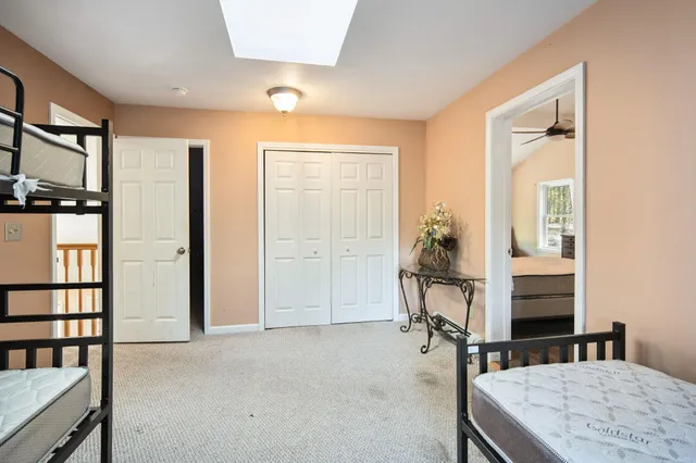 an empty room with windows and bathroom