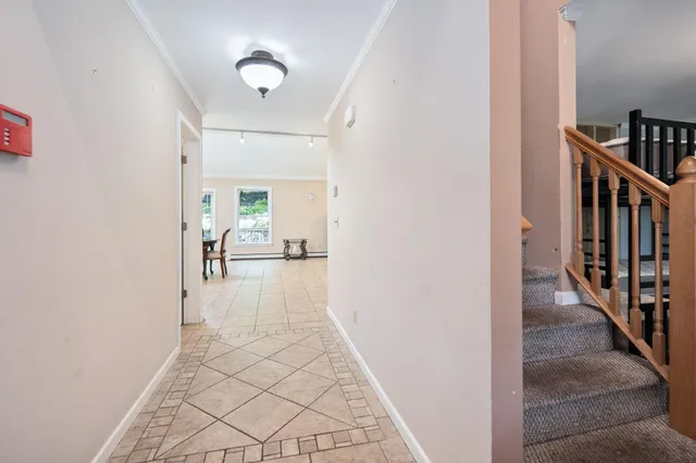 a view of a hallway view with staircase