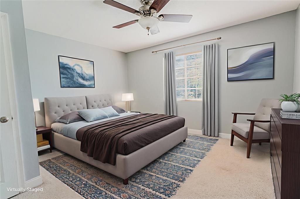 2935 Aein Road Orlando, FL 32817 - Photo 17 of 27 a bedroom with a bed and wooden floor