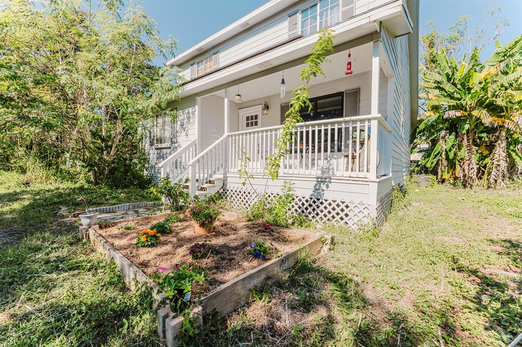 2935 Aein Road Orlando, FL 32817 - Photo 2 of 27 a view of a house with a small yard and wooden fence