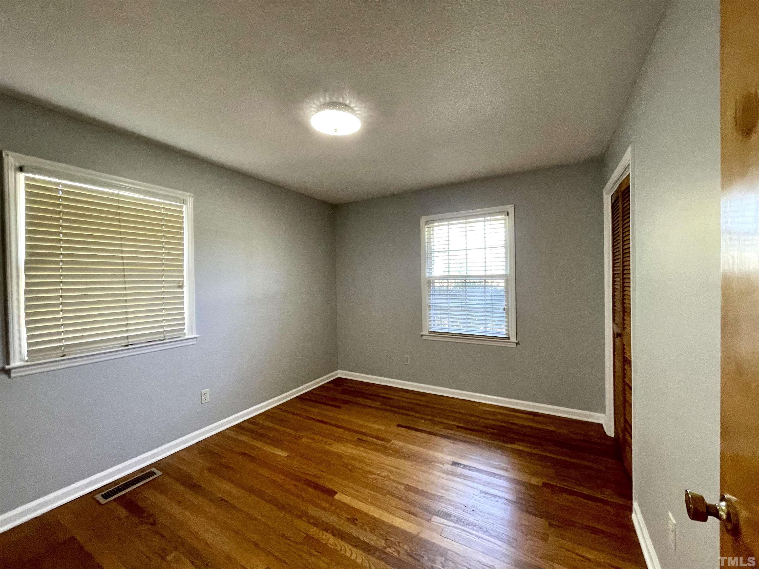 2995 Government Road Clayton, NC 27520 - Photo 12 of 15 a view of a room with wooden floor and windows