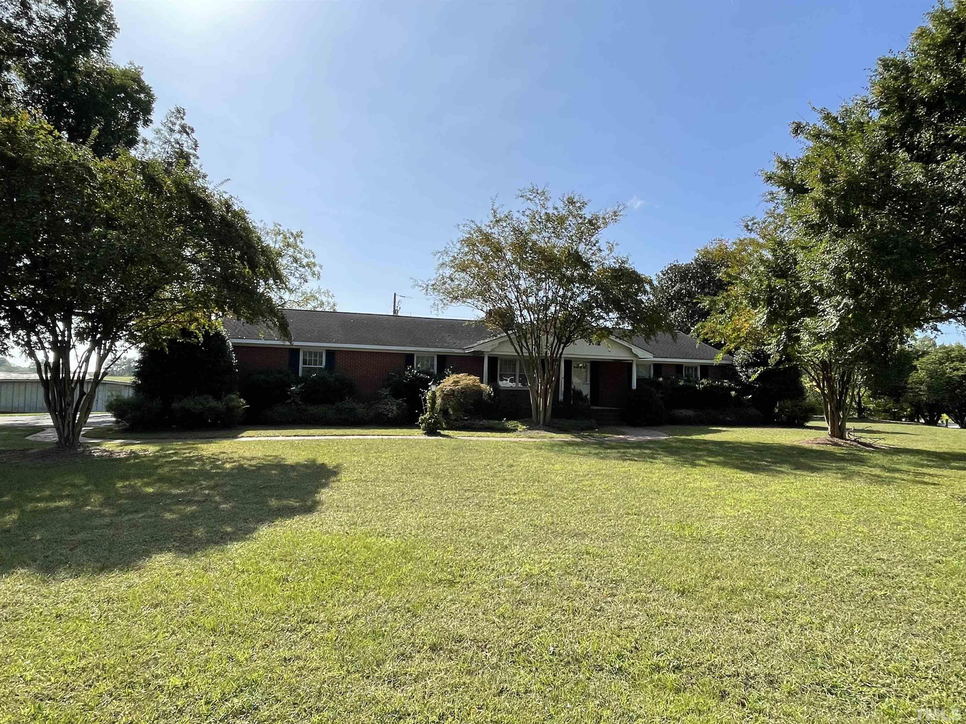 2995 Government Road Clayton, NC 27520 - Photo 2 of 15 a front view of a house with a yard