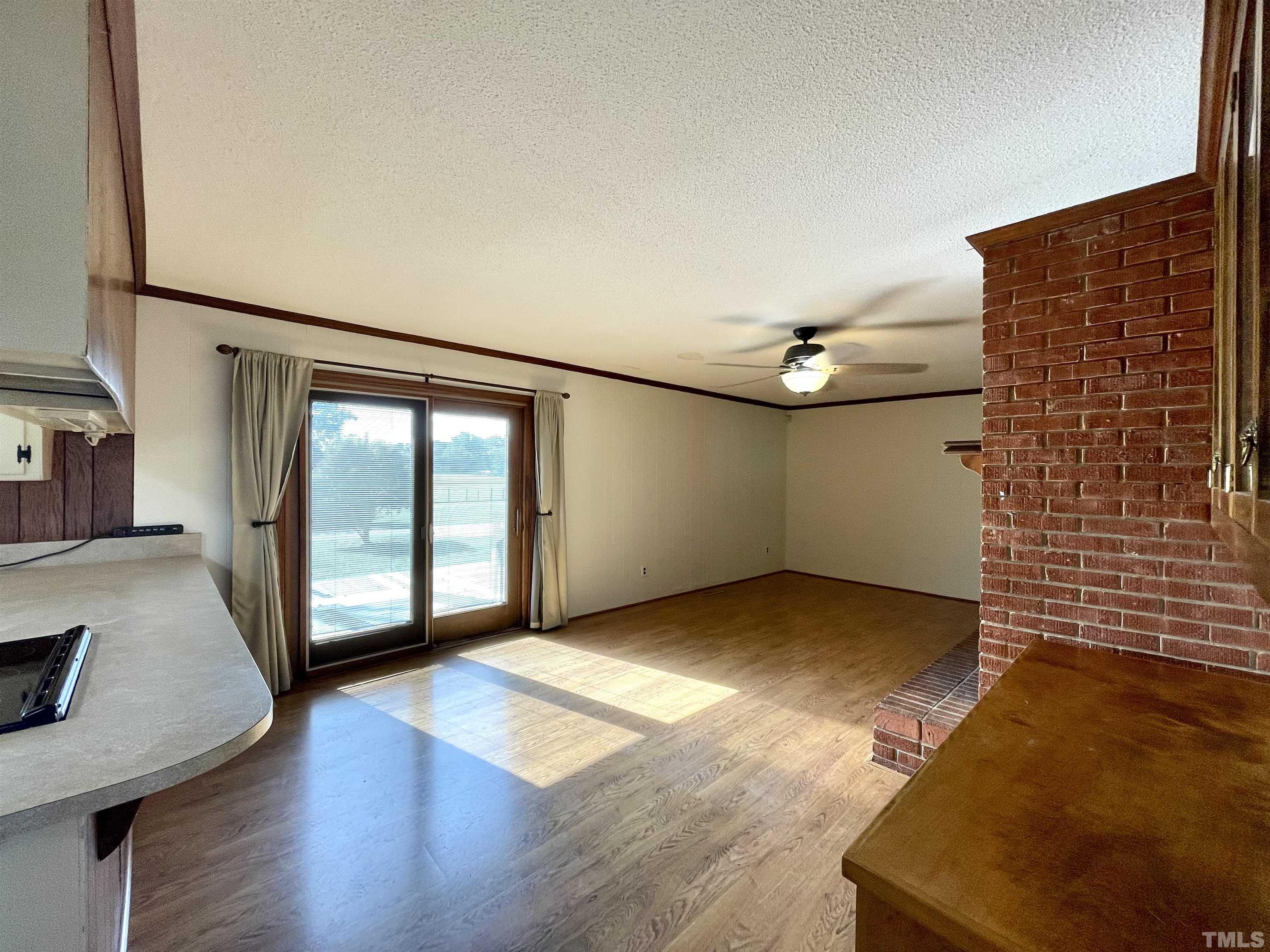 2995 Government Road Clayton, NC 27520 - Photo 4 of 15 a view of a livingroom with wooden floor