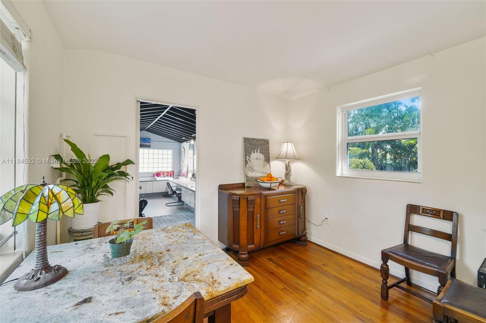 5842 Alton Road Miami Beach, FL 33140 - Photo 16 of 36 a living room with furniture and a wooden floor