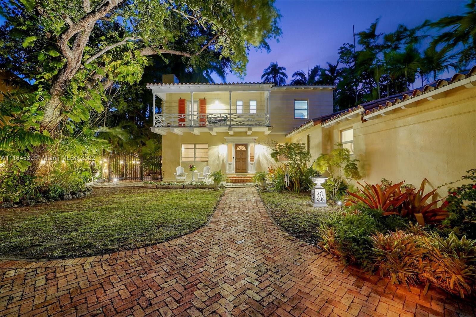 5842 Alton Road Miami Beach, FL 33140 - Photo 25 of 36 a view of a street with a building in the background