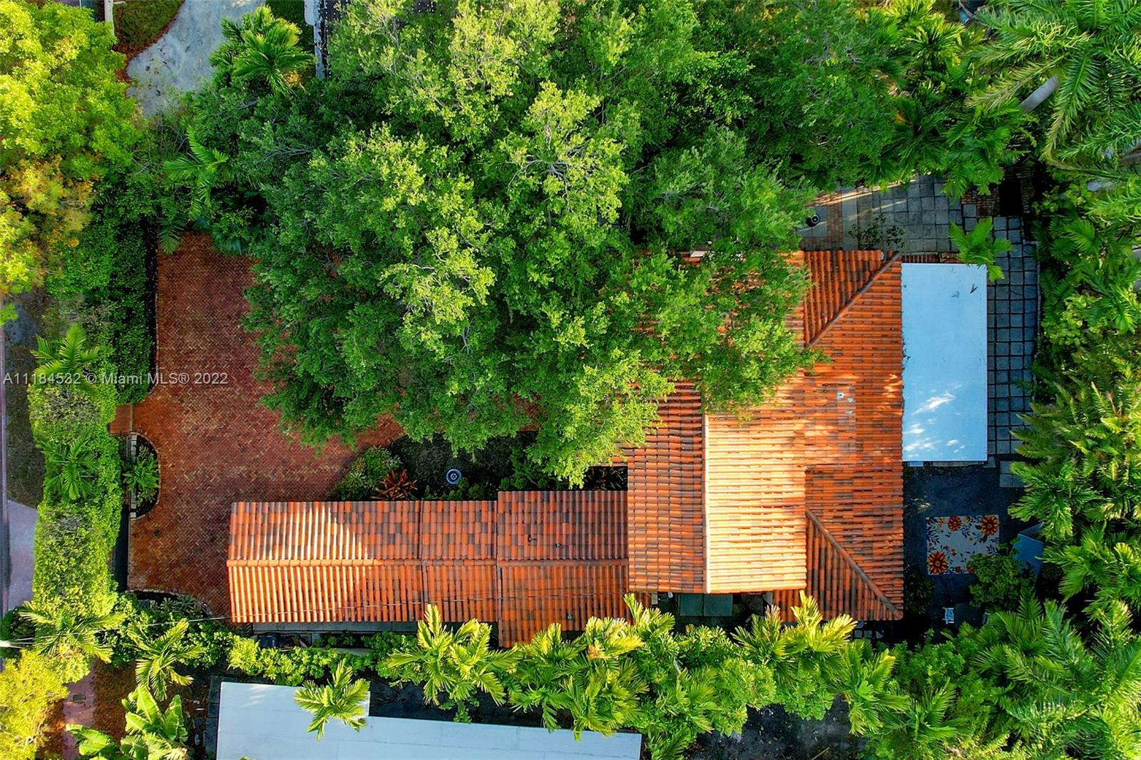 5842 Alton Road Miami Beach, FL 33140 - Photo 27 of 36 front view of a house with a garden