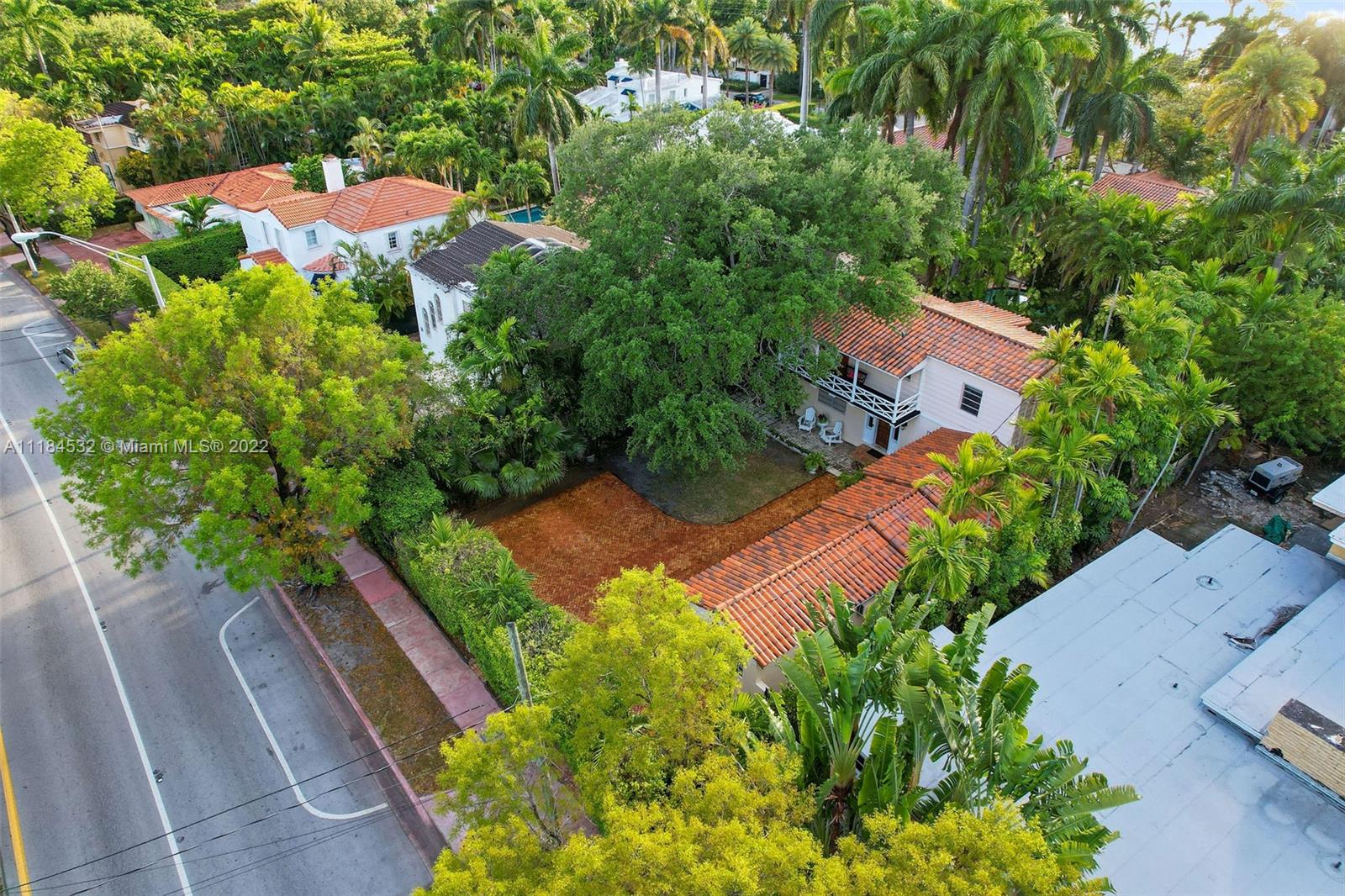 5842 Alton Road Miami Beach, FL 33140 - Photo 28 of 36 an aerial view of a house with a yard