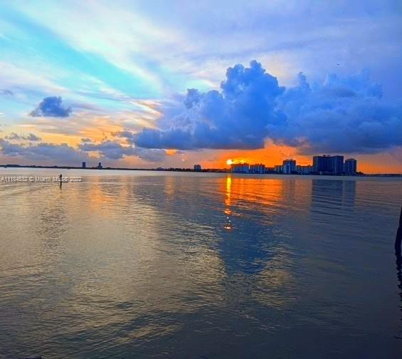 5842 Alton Road Miami Beach, FL 33140 - Photo 36 of 36 a view of an ocean with sunset