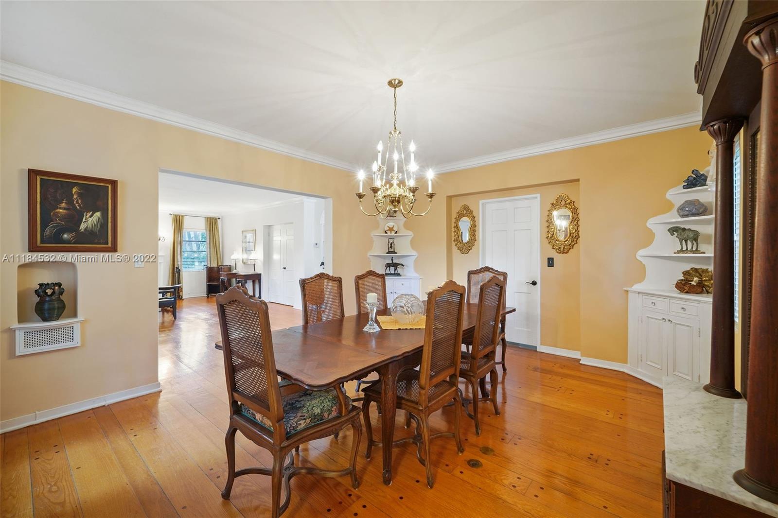 5842 Alton Road Miami Beach, FL 33140 - Photo 5 of 36 a dining room with furniture and window