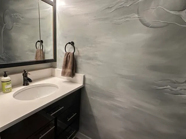a bathroom with a sink and a mirror