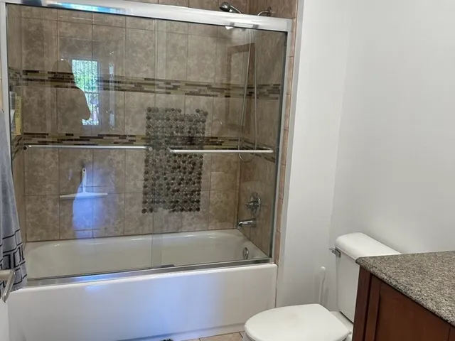 a bathroom with a bathtub and a toilet