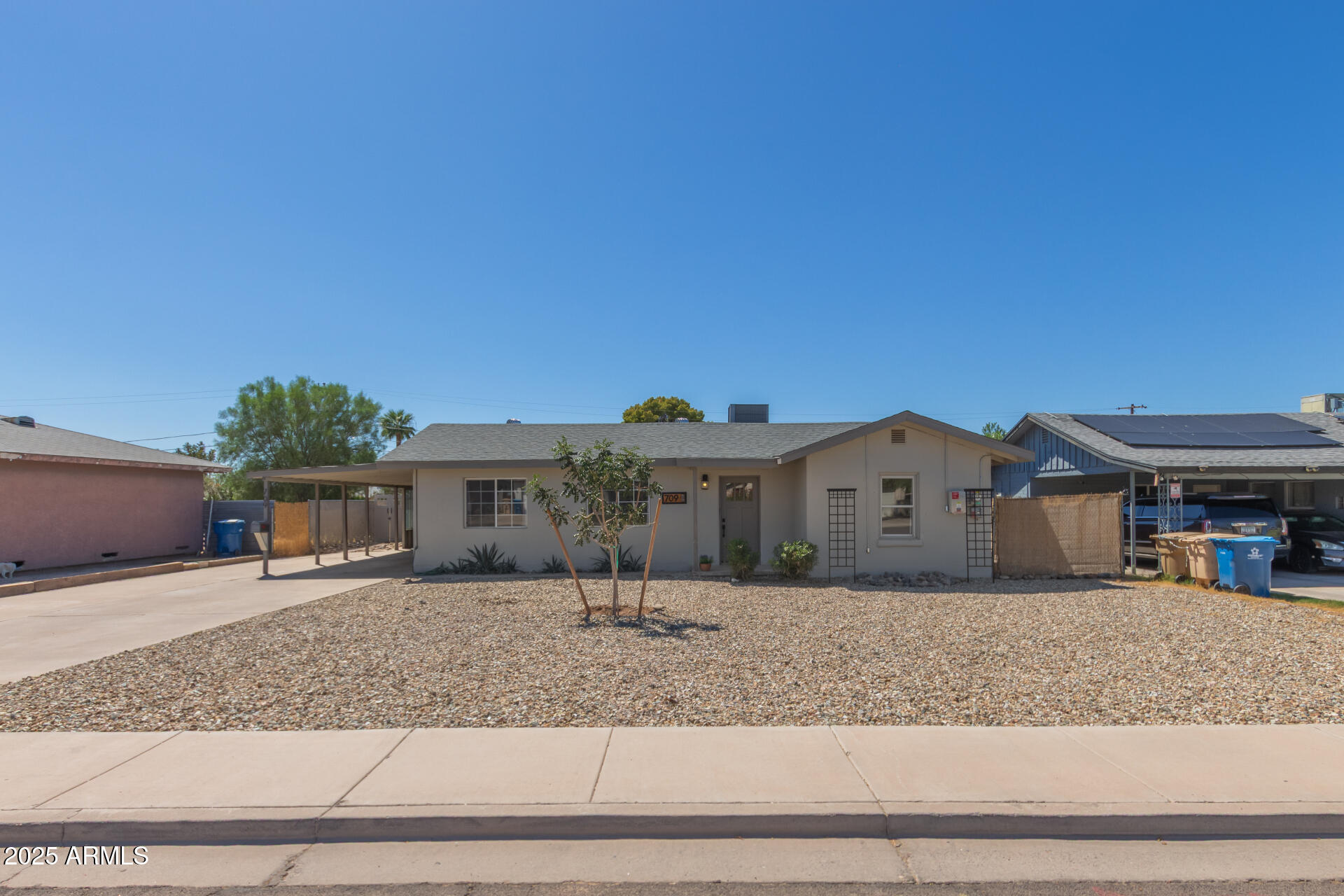 709 East Edison Avenue Buckeye, AZ 85326 - Photo 30 of 33 a front view of a house with a yard