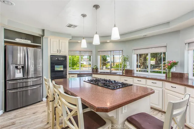a kitchen with a refrigerator stove and sink