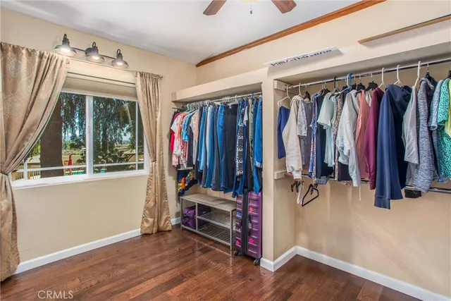 a bathroom with a sink vanity granite tub and a mirror