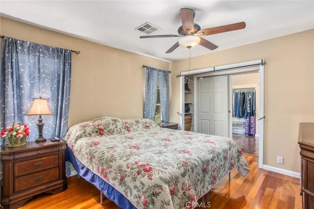 a living room with a bed furniture and a window