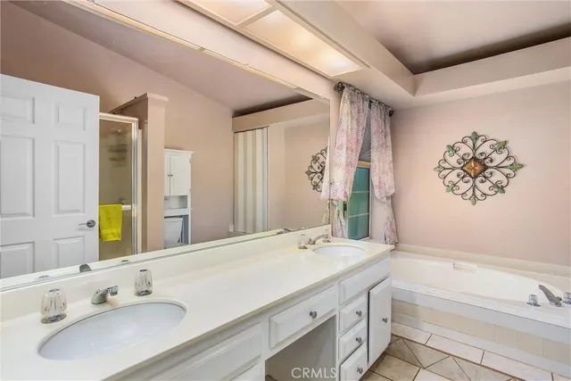 a view of a storage & utility room with refrigerator and natural light