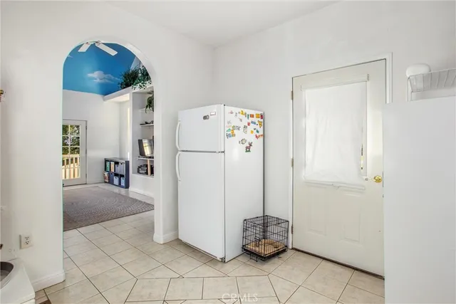 a bedroom with a bed and a book shelf